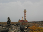 27849 Pillar of rocks and lighthouse Faro de Toston.jpg